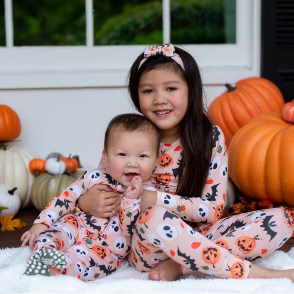 Well loved, Little bum bums bamboo pjs! Super cute girlie jack o lantern pjs!